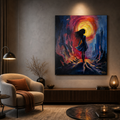 A vertical canvas painting of a woman's silhouette against a fiery red, orange, and blue sunset, displayed on a gray wall in a modern, dimly lit living room.